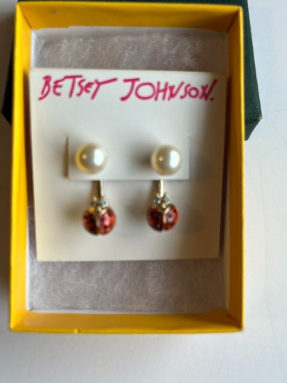 Betsy Johnson ladybug and pearl earrings.